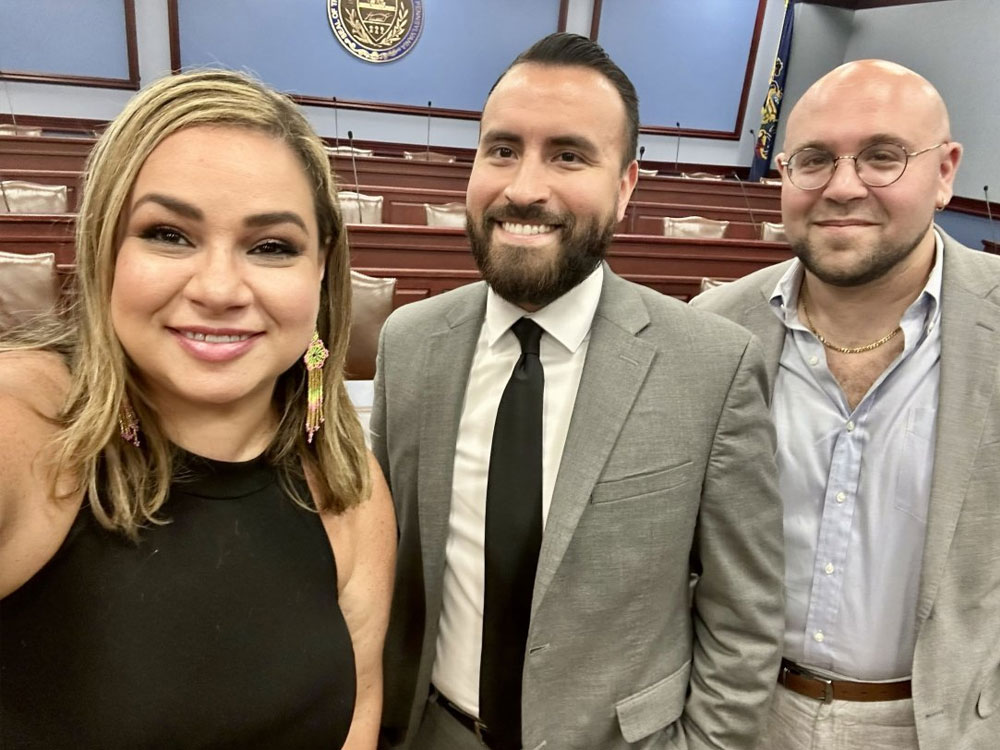 Free Press Action’s Vanessa Maria Graber and Eric Thurm flank Guerrero Lopez (center), the executive director of the Pennsylvania Legislative Latino Caucus